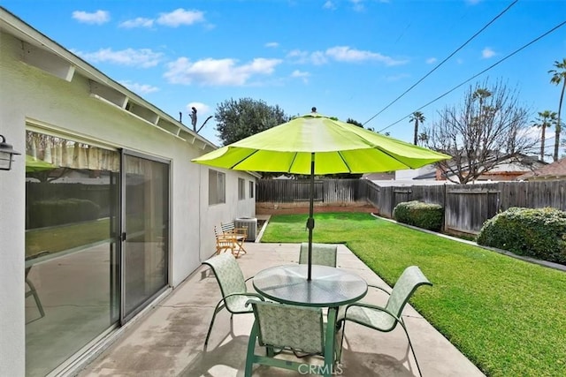 view of patio / terrace featuring outdoor dining area, central air condition unit, and a fenced backyard