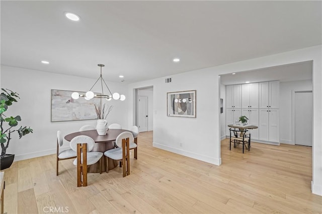 dining area with visible vents, baseboards, light wood-type flooring, a chandelier, and recessed lighting