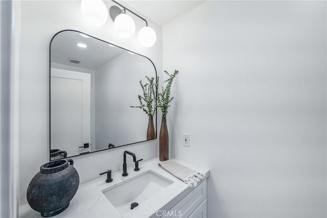 bathroom featuring visible vents and vanity