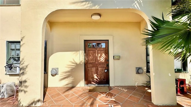 doorway to property with stucco siding