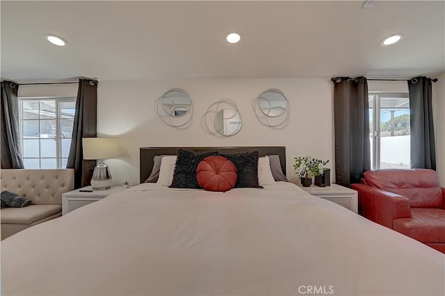 bedroom featuring multiple windows and recessed lighting