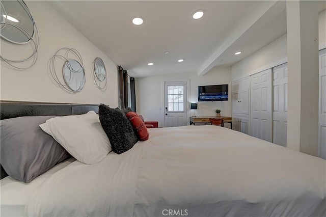 bedroom featuring lofted ceiling with beams, a closet, and recessed lighting