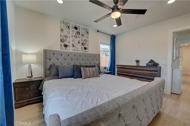 bedroom featuring washer / clothes dryer, recessed lighting, a ceiling fan, and light wood-style floors