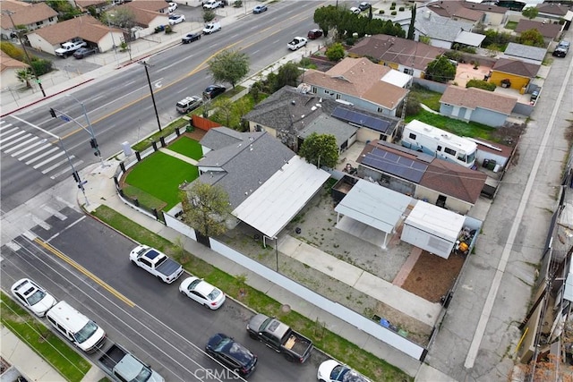 birds eye view of property with a residential view