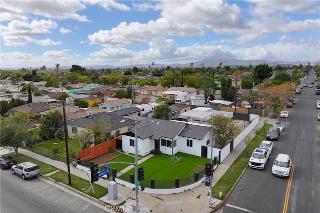 drone / aerial view with a mountain view and a residential view