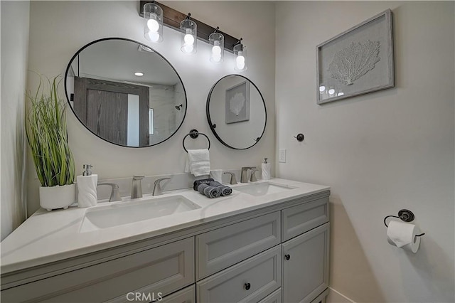 full bathroom with double vanity and a sink