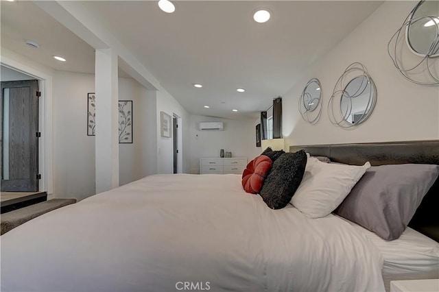 bedroom featuring recessed lighting and a wall mounted AC