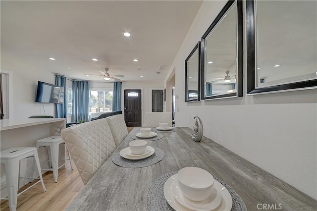 dining area with ceiling fan, light wood finished floors, and recessed lighting