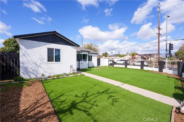 view of yard featuring fence