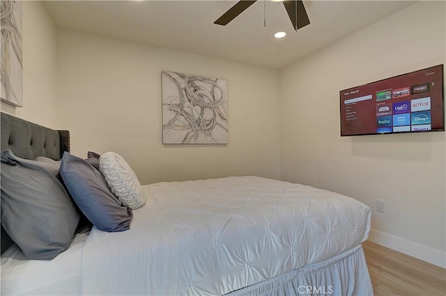 bedroom with ceiling fan, recessed lighting, wood finished floors, and baseboards