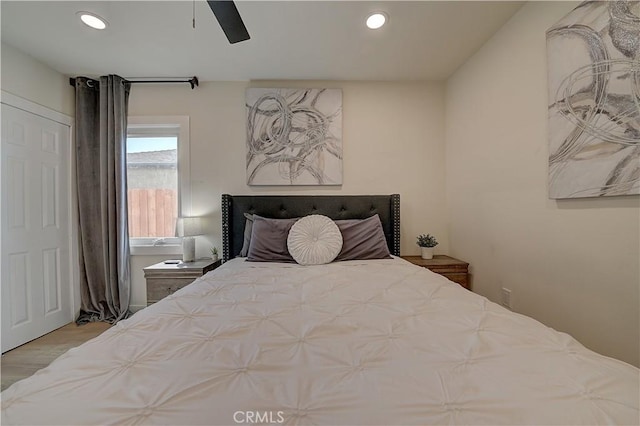 bedroom with a ceiling fan, recessed lighting, and wood finished floors