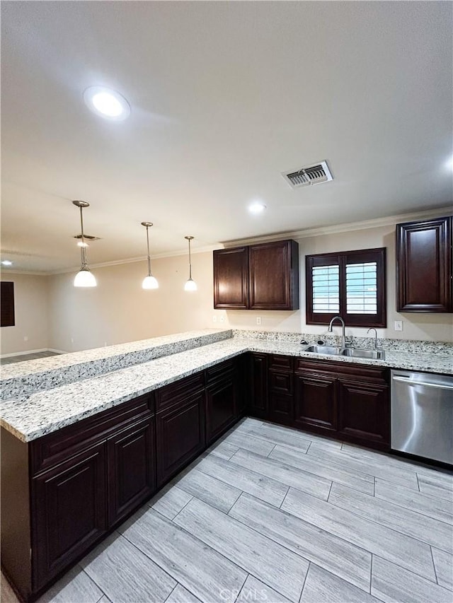 kitchen with visible vents, dishwasher, a peninsula, dark brown cabinets, and a sink