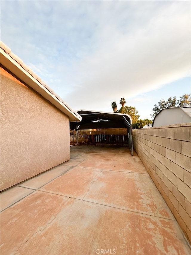 view of patio featuring fence