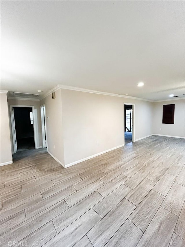unfurnished room featuring baseboards and wood tiled floor