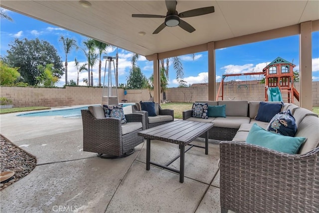 view of patio with a fenced in pool, a fenced backyard, ceiling fan, a playground, and an outdoor hangout area