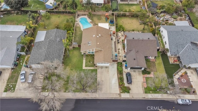 birds eye view of property with a residential view