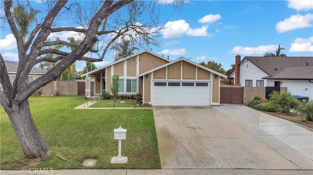 view of front of house featuring a front lawn, an attached garage, fence, and concrete driveway