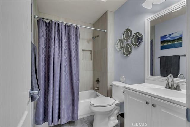 full bath featuring vanity, toilet, and shower / tub combo with curtain