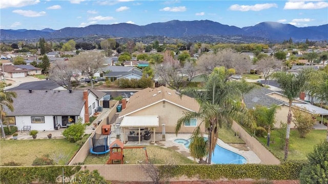 drone / aerial view with a residential view and a mountain view