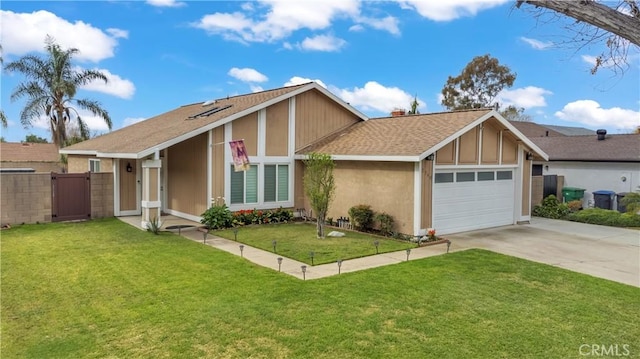 view of front of home with stucco siding, driveway, roof with shingles, an attached garage, and a front yard