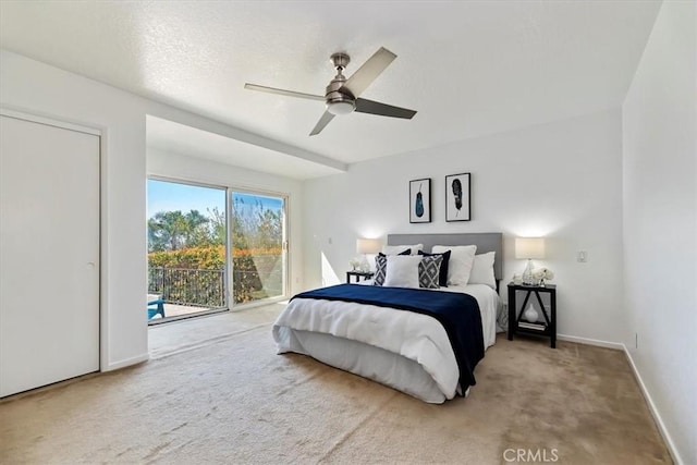 bedroom featuring baseboards, a ceiling fan, access to outside, a textured ceiling, and carpet flooring