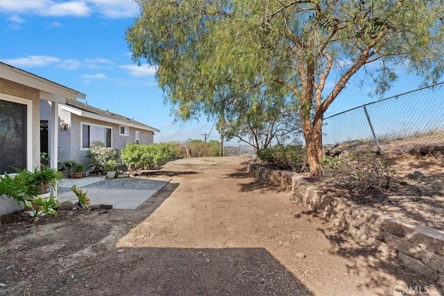 view of yard with a patio area and fence