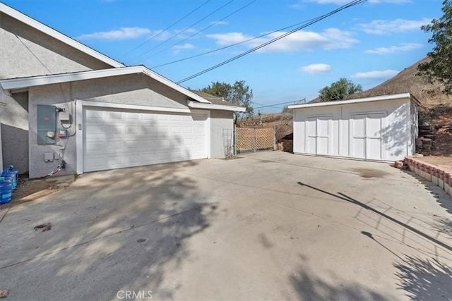 garage featuring fence