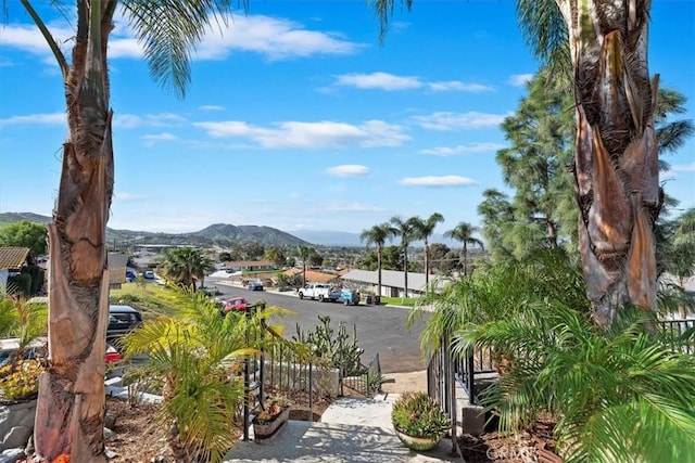 view of property's community featuring a mountain view and fence