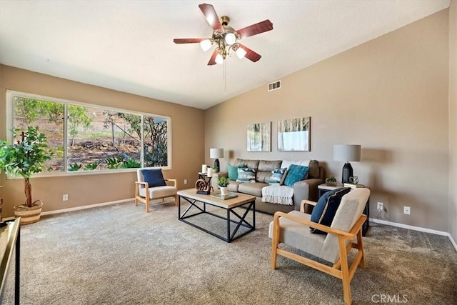 living area with lofted ceiling, carpet, visible vents, and baseboards