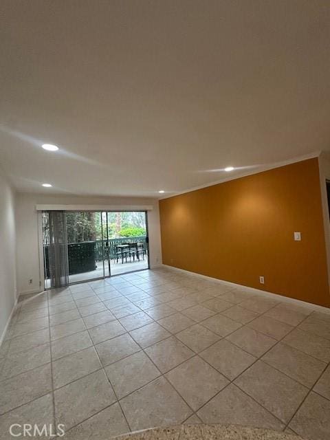 empty room with light tile patterned floors, recessed lighting, and baseboards