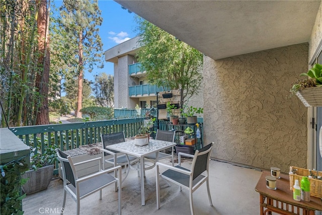 balcony featuring outdoor dining area