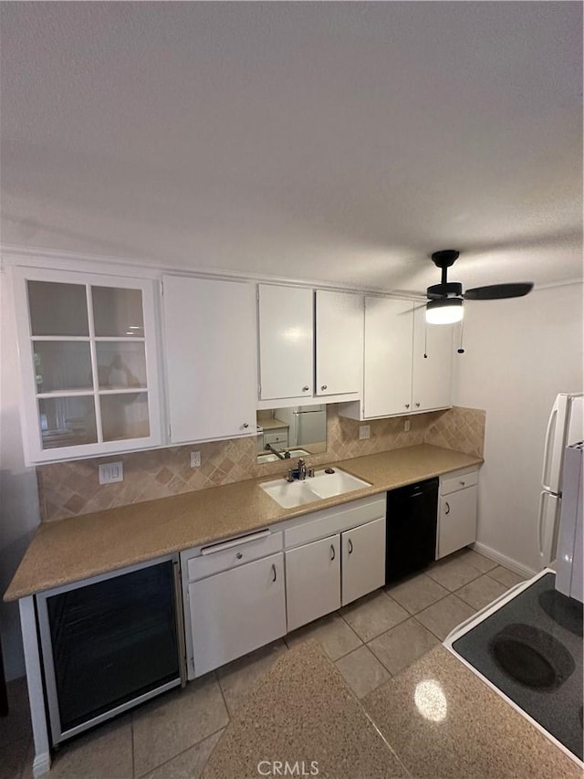 kitchen featuring a sink, wine cooler, dishwasher, range, and tasteful backsplash