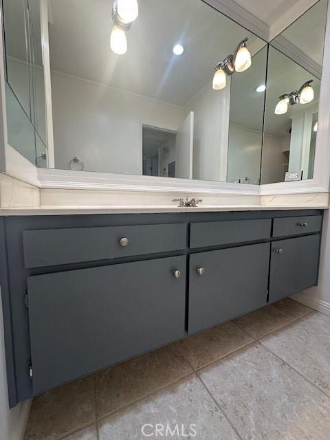 bathroom with tile patterned floors and vanity