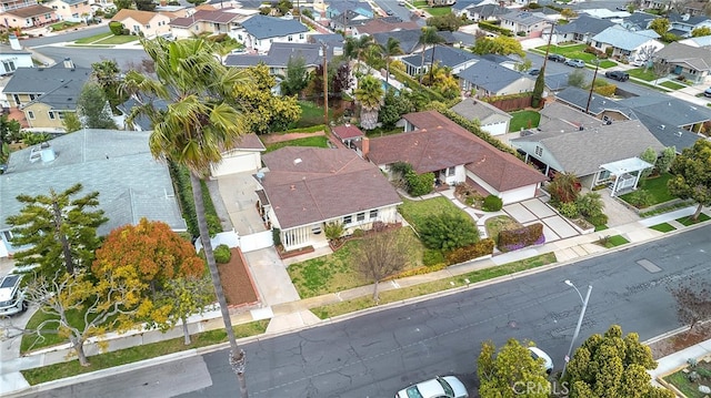 birds eye view of property with a residential view