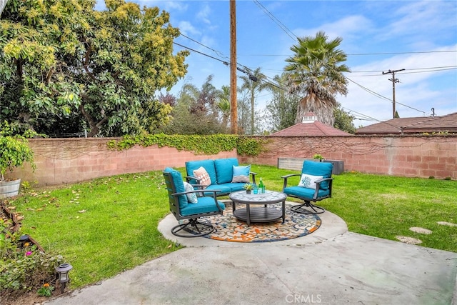 view of yard featuring a patio area, a fenced backyard, and outdoor lounge area