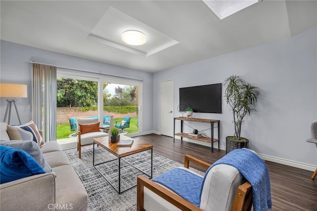 living room featuring baseboards and wood finished floors