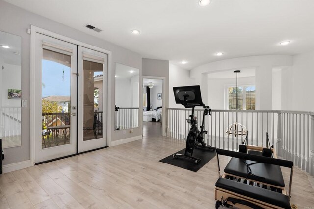 exercise room with recessed lighting, visible vents, baseboards, and wood finished floors