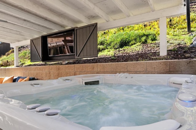 view of pool featuring a hot tub