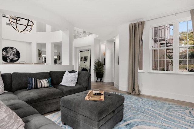 living area featuring baseboards and wood finished floors