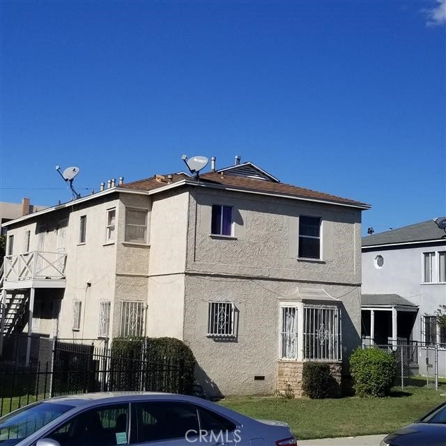 view of property with fence