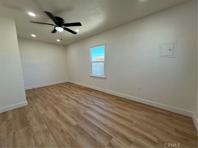 unfurnished room featuring recessed lighting, light wood-type flooring, baseboards, and ceiling fan