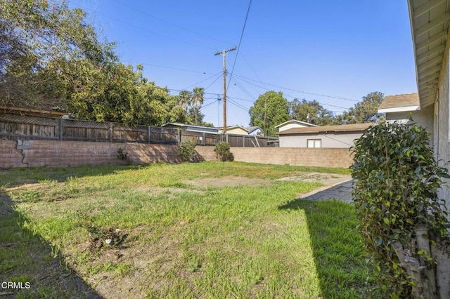 view of yard featuring a fenced backyard