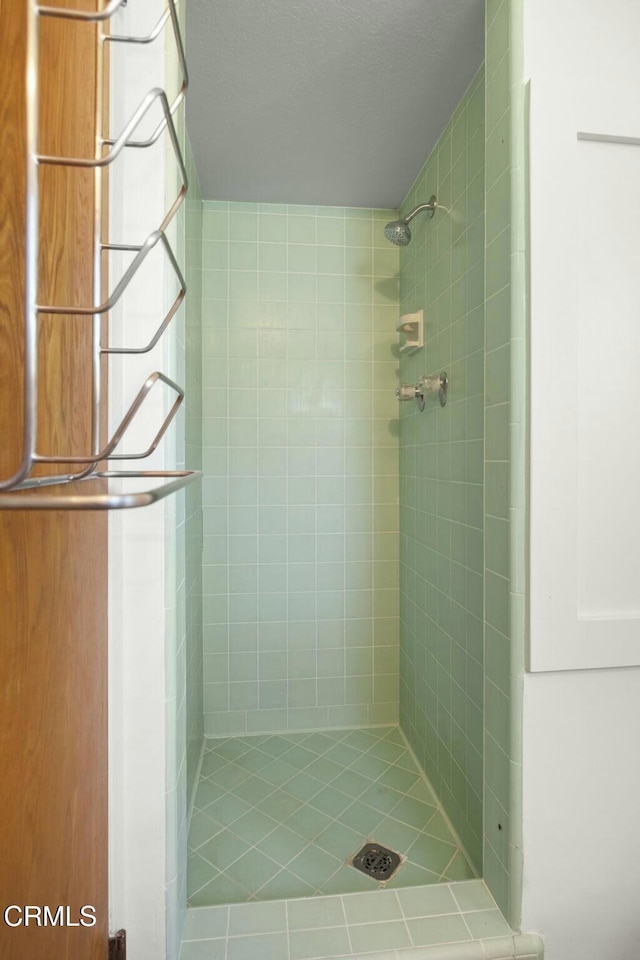 bathroom featuring a stall shower