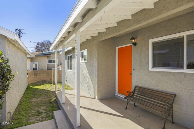 view of patio / terrace featuring fence