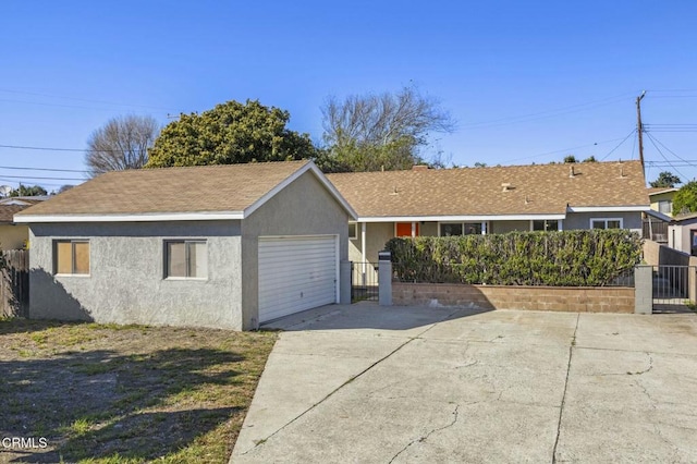 exterior space featuring a gate, fence, and stucco siding