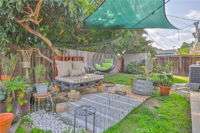 view of patio / terrace with a fenced backyard and central air condition unit