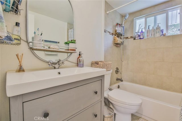 bathroom featuring vanity, toilet, and shower / bathtub combination