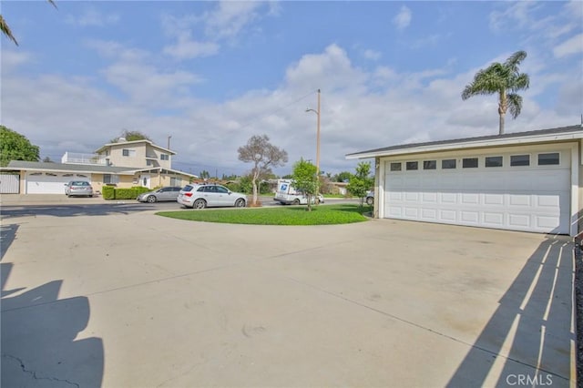 exterior space with driveway and street lighting