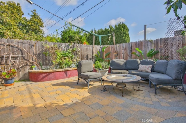 view of patio with an outdoor hangout area and a fenced backyard