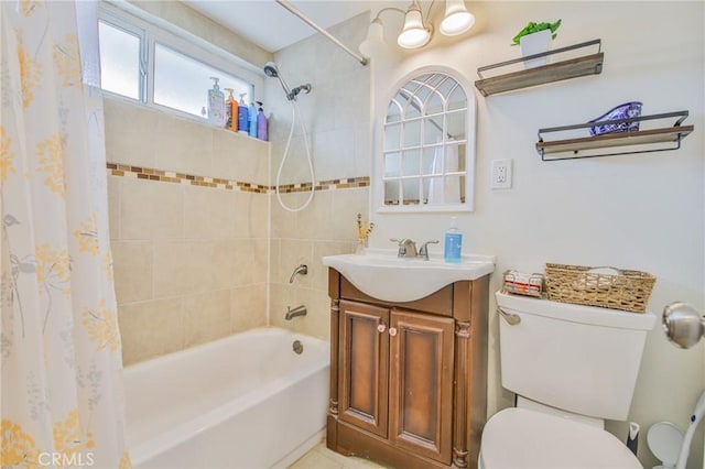 full bathroom with shower / tub combo with curtain, vanity, and toilet